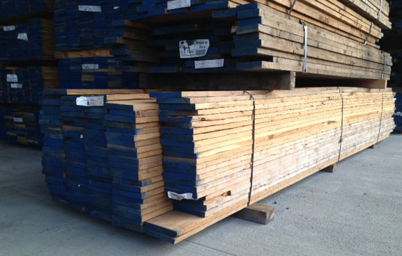 Photo - Australian Cypress lumber planks. Warehouse stack. ©all rights reserved.
